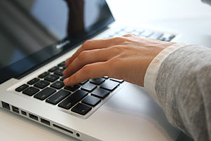 Hand on Laptop