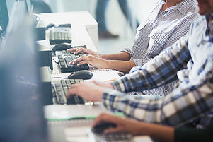 Students Typing at Their Computer